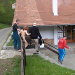 At a holiday home and in a bar with some friends