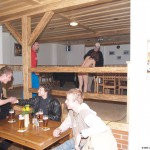 At a holiday home and in a bar with some friends