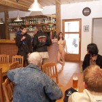 At a holiday home and in a bar with some friends