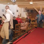 At a holiday home and in a bar with some friends