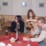 At a holiday home and in a bar with some friends