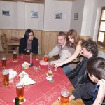 At a holiday home and in a bar with some friends