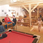 At a holiday home and in a bar with some friends