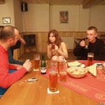 At a holiday home and in a bar with some friends