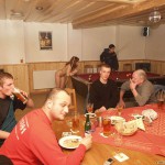 At a holiday home and in a bar with some friends