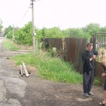 In front of and inside a car repair