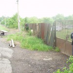 In front of and inside a car repair