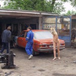 In front of and inside a car repair