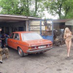 In front of and inside a car repair