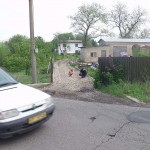 In front of and inside a car repair