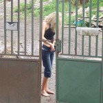 In front of and inside a car repair