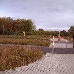 A parking lot next to a main road